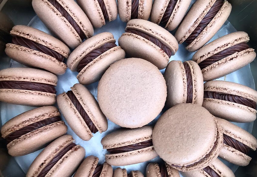 Home-baked chocolate French macarons.